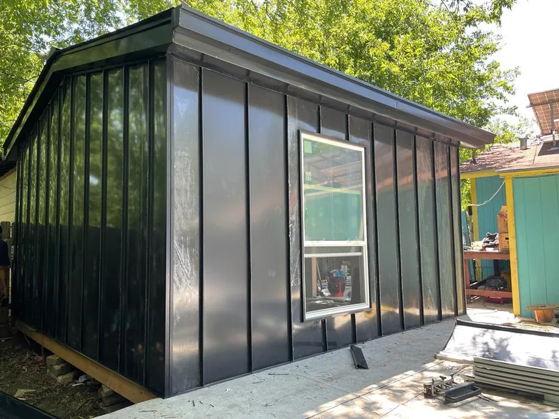 Black standing seam metal wall panels for Roof Inspection in Little Falls